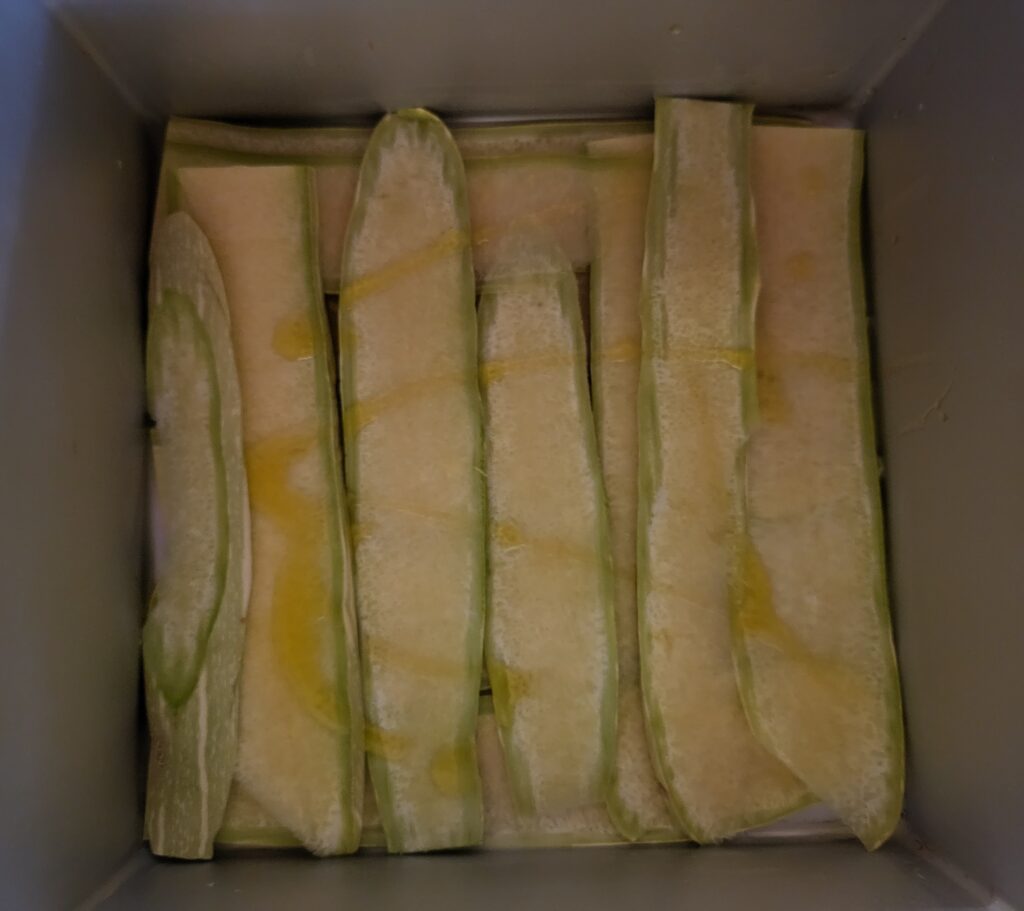 assemblaggio parmigiana di zucchine
